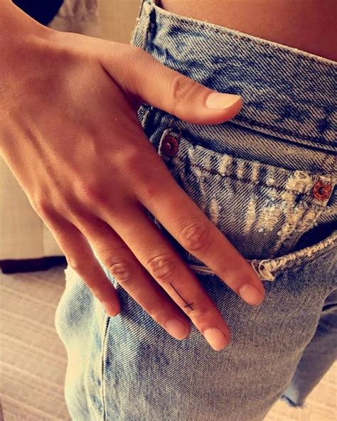 Tiny Cross Tattoo On Chloe Bartoli S Finger