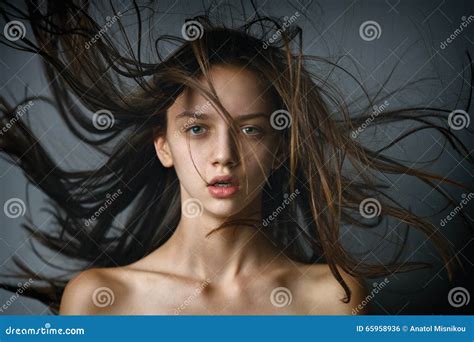 Closeup Beauty Portrait Of A Brunette Girl With Flying Hair Stock Photo