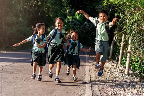 Excited Kids Walking After School By Stocksy Contributor Santi Nuñez