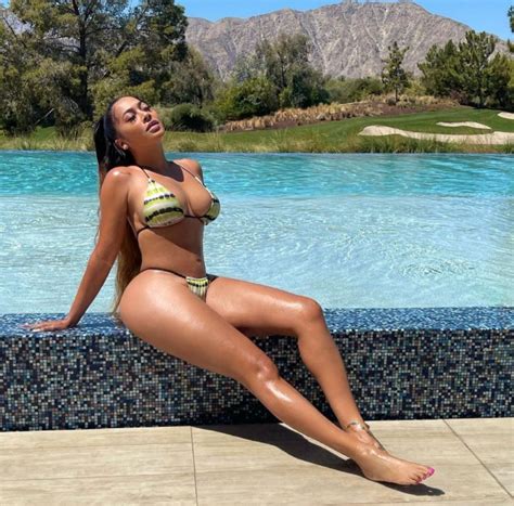 La La Anthony Almost Spills Out Of Her Tiny Bikini As She Soaks Up The