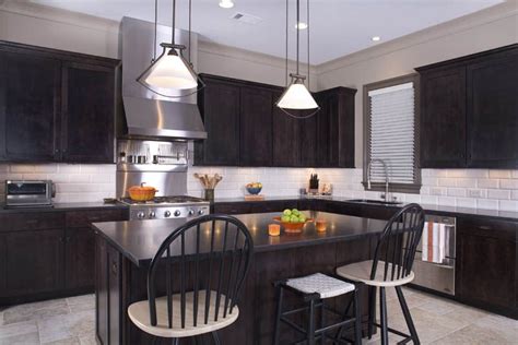 Providing a neutral backdrop, white kitchen cabinets can be left alone or dressed up with colorful art and accessories. Integrity Cabinets, Bella style in Ebony stain | Custom ...