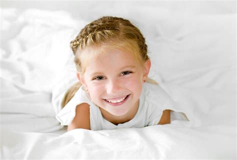 Premium Photo Adorable Little Girl Wake Up In Her Bed