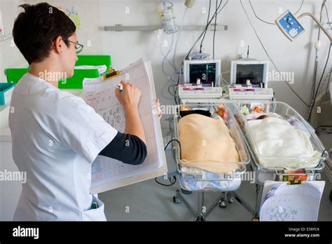 Paediatric Nurse And Premature Newborn Babies Twins Obstetrics And