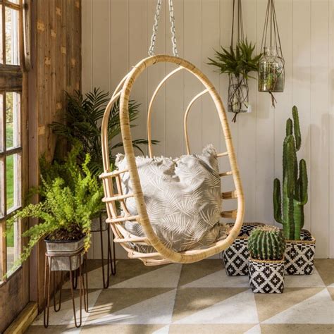 Mid century, hanging, egg chair features an open weave, fat rattan frame with newly upholstered double seat cushion in burnt orange chenille. Hanging Rattan Egg Chair // Graham & Green #bohemian #boho ...