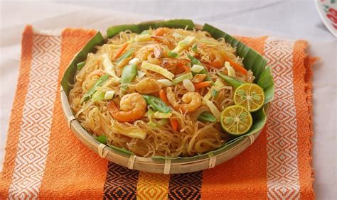 A Stir Fried Rice Noodle Dish With Assorted Veggies And Shrimps A