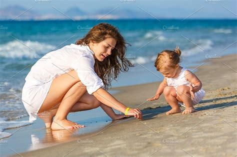Mother And Daughter Playing On The Beach With Images Mother