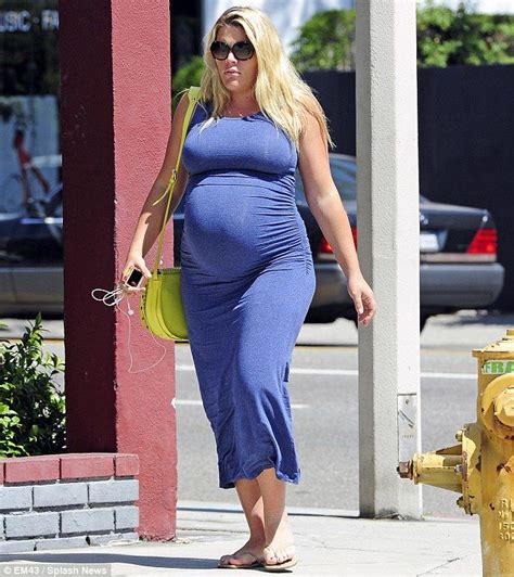 my bump looks fake heavily pregnant busy philipps looks ready to pop in a very tight maxi