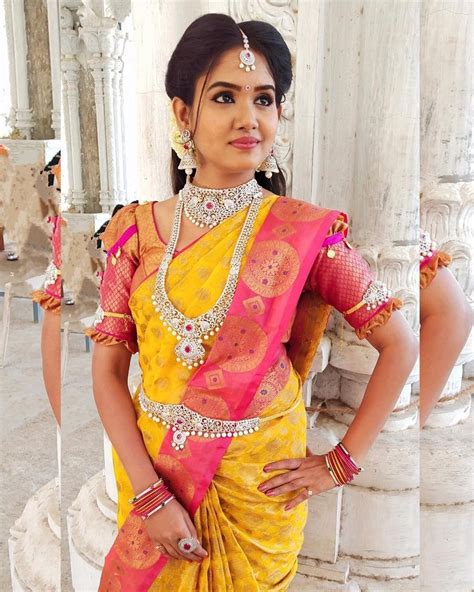 In A Bridal Look In Pink And Yellow Color Pattu Kanjeevaram Saree Elbow Length Sleeve Blouse