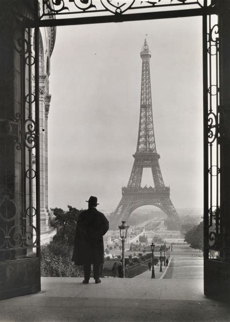 Vintage Shot Of A Man Looking Out At The Eiffel Tower The Structure