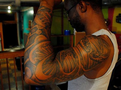 Check out 10 of the hottest black men with tattoos. Black People Tattoos: 25 Attractive Designs with Images ...