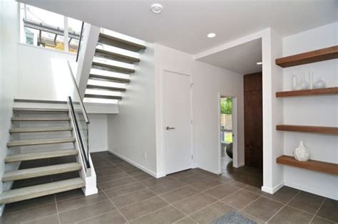 Concrete stairs are easier to integrate with color because of the vertical step. Warm And Modern Designs Featuring Concrete