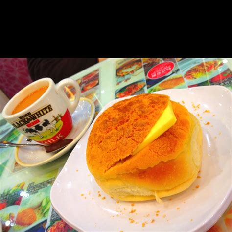 Thereafter, add evaporated milk to it and boil again. Hong Kong Milk Tea and Hot "Pineapple" Bun with Butter