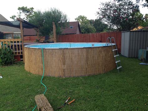 Diy Camoflauge Above Ground Pool With Bamboo Or Reed Fencing Diy Pool Fence Above Ground Pool