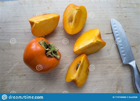Fresh Persimmon On A Wooden Table Stock Photo Image Of Oriental