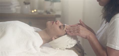 Masseuse Rubbing Woman Forehead In Spa By Omri Ohana Royalty Free Stock Footage
