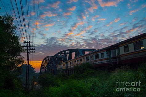 Train Passing By Over Rural Railway Bridge In The Morning Or At