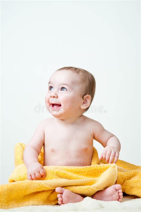 Baby Boy Sitting Wrapped In Yellow Towel Stock Image Image Of