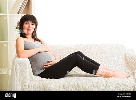Pregnant Woman Resting On The Sofa Stock Photo Alamy