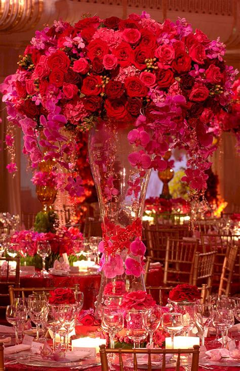 Burgundy velvet chairs and assorted chandeliers uner reception tent. Red And Pink Flowers Centerpieces Idea For Wedding in ...