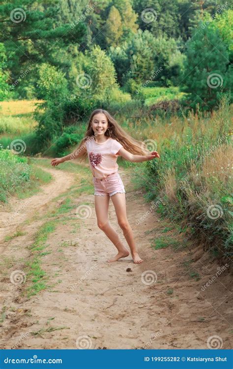 Beautiful Teen Girl Is Dancing Outside At Summer Sunset Stock Photo