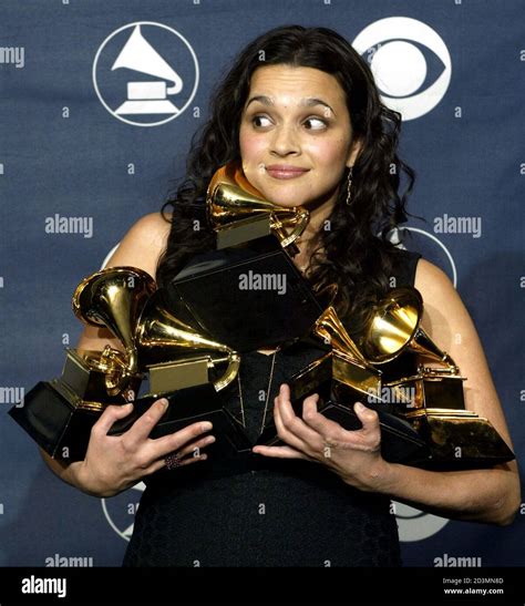 Singer Norah Jones Poses For Photographers With Her Five Grammy Awards For Best Pop Vocal Album