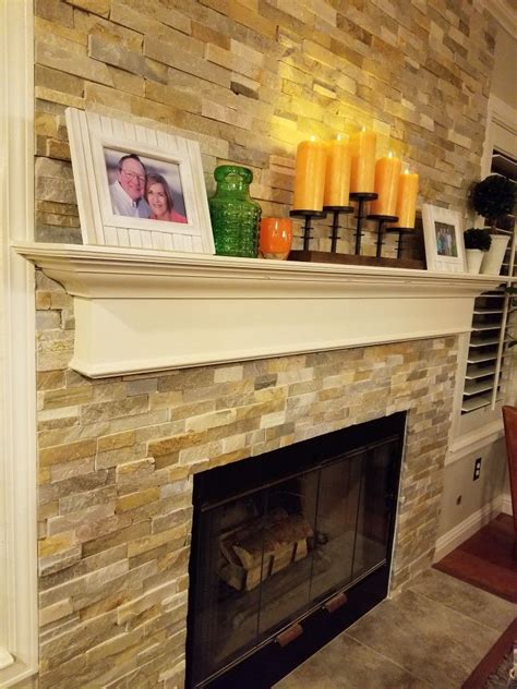 In the room below, darker stone. Fireplace update with mosaic tile/stone | Fireplace update ...
