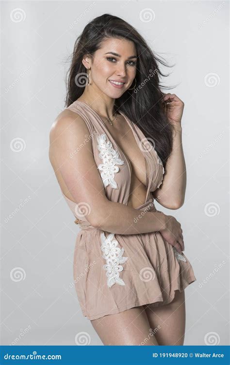Beautiful Brunette Model Posing In A Studio Environment Stock Photo