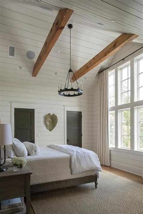 Shiplap on the ceiling is beautiful and elevates the whole room. Cottage bedroom with gray shiplap vaulted ceiling features ...