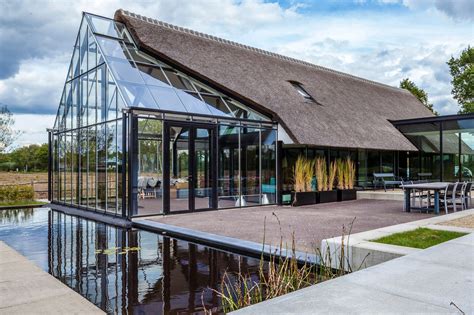 Cottage Meets Greenhouse In Modern Thatched Home Roof Architecture