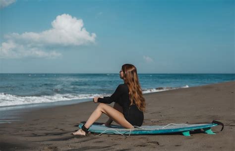 Free Photo Young Beautiful Girl Posing On The Beach With A Surfboard Woman Surfer Ocean Waves