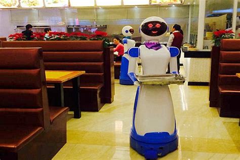 chinese restaurant employs robot waiters to save money on staff costs daily mail online
