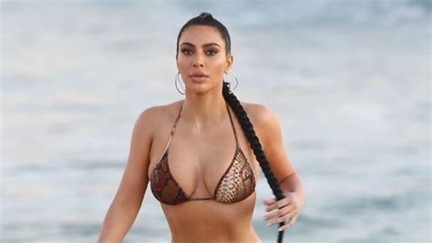 Kim Kardashian Slays In Tiny White String Bikini For Skims Photos