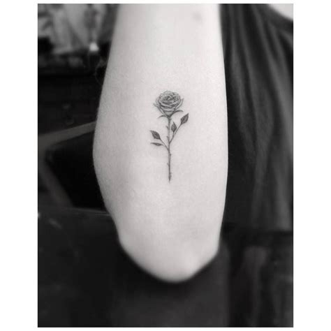 Fine Line Rose Tattoo On The Right Forearm Tiny Rose Tattoos Elbow