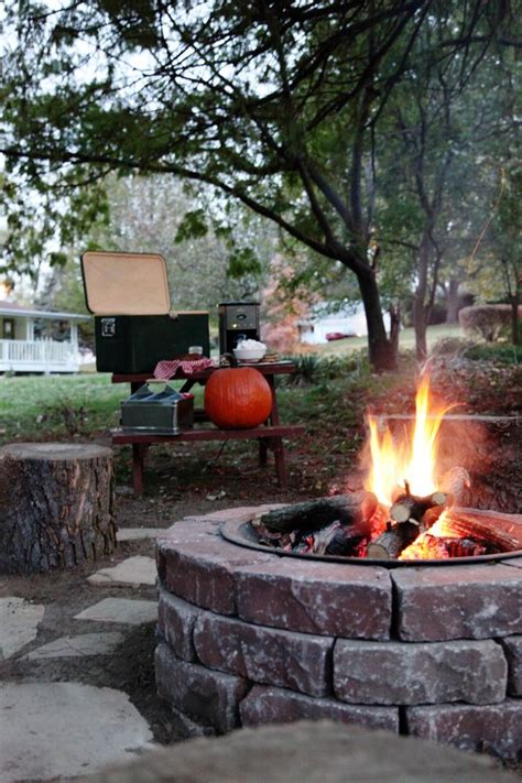 It is made to contain a fire, as needed, and includes a wood grate, mesh cover and poker. It's finally fall! Enjoying our DIY Fire Pit | Fire pit ...