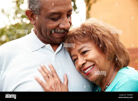 Senior Black Husband And Wife Embracing Outdoors Close Up Stock Photo