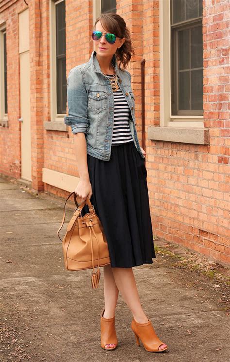 She styled hers over mesh leggings and colorful sneaks. How To Wear Midi Skirts This Summer 2020 | FashionGum.com