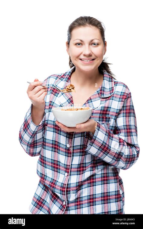 Cheerful Beautiful Brunette In Pajamas Eating Breakfast Cereal With