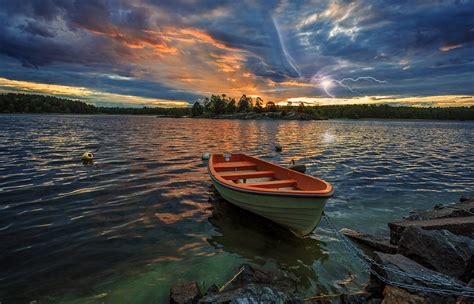 Boat In Sunset And Lightning Over Swedish Lake Hd