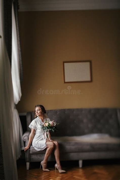Gorgeous Beautiful Bride In Silk Robe And Veil Holding Modern Bo Stock