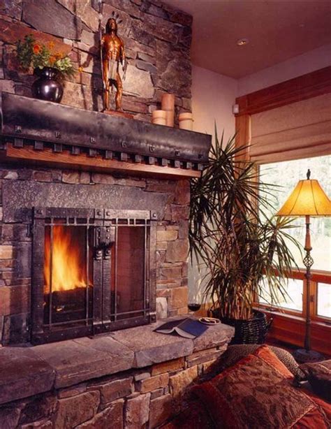 The beautiful woodwork on this fireplace surround secures its inclusion in this list. Pin by Phillip Tate on Rustic Stone Fireplace Ideas ...