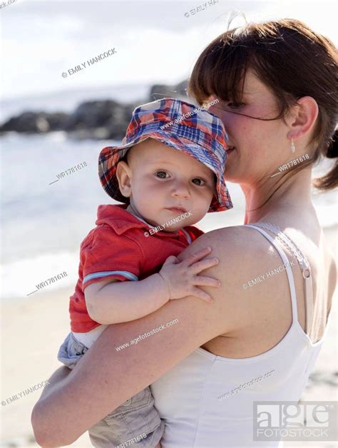 Mother Holding Her Baby Son Stock Photo Picture And Royalty Free
