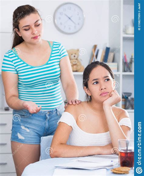 Quarrel Two Girls Because Of Smartphone Take Away Gadget From Each Other Stock Image