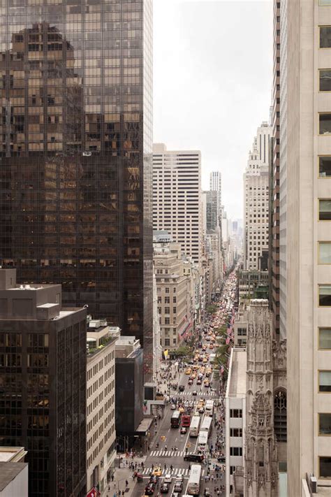 High Angle View Of Busy Street Amidst Buildings In City Stock Photo