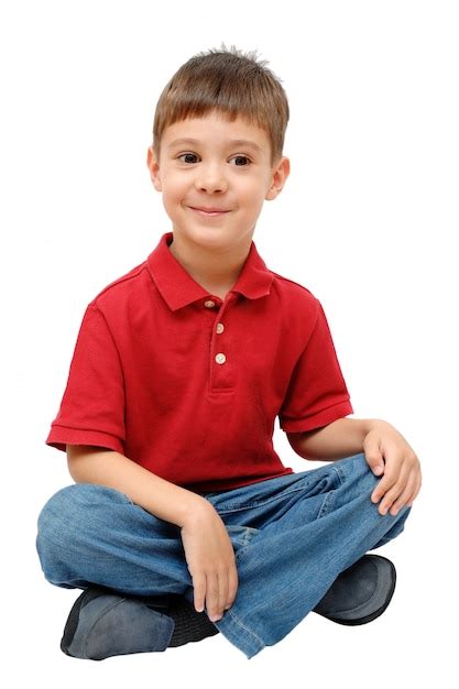 Portrait Of Child Sitting On Floor Isolated On White Photo Premium
