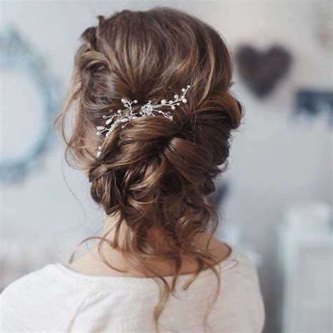 A medium length curly bob is a great transitional hairstyle for those who have had long hair for a while. This beautiful loose curl bridal updo hairstyle perfect ...