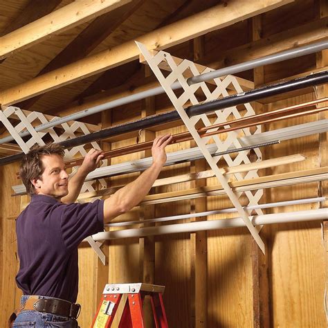 Diy helping hands tool and material holder from pvc. 11 Ideas for Organizing Your Garage — The Family Handyman