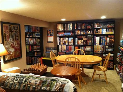 A Living Room Filled With Furniture And Bookshelves Next To A Dining