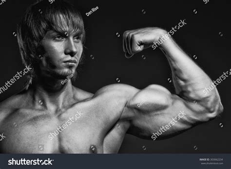 Bodybuilder Showing His Back Biceps Muscles Stock Photo 303062234