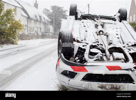Overturned Car After Traffic Accident In Winter Snow Stock Photo Alamy