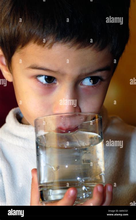 Boy Drinking Water Stock Photo Alamy